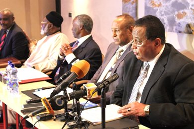 The head of the Sudanese government's negotiating team, Ibrahim Gandour (R), speaks at the opening session of peace talks in the Ethiopian capital, Addis Ababa, on 13 February 2014. The SPLM’s Yasir Arman appears at the extreme left of the table, while the mediators and UN envoy are pictured in the middle (Photo: AUHIP)
