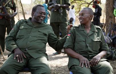 Riek Machar sits next to his wife Angelina Teny in front of their tent in rebel-controlled territory inside Jonglei state, on 31 January 2014 (Photo: Reuters/Goran Tomasevic)