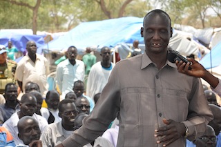 One of the chiefs representing Internally Displaced People in Bor, William Tut, speaks to government delegates in United Nations Mission in South Sudan camp in Bor. 29 March 2014 (Source: John Actually/ST)