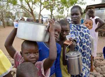 South Sudanese refugees line up to receive breakfast at Kenya's Kakuma refugee camp (Lucy Murunga/World Vision)