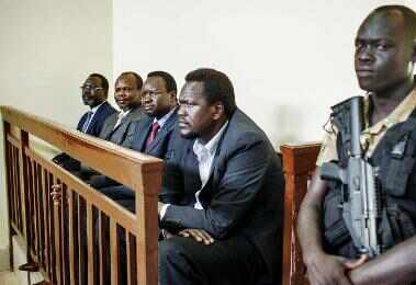 South Sudan political detainees (from left to right) Ezekiel Lol Gatkuoth, Majak d’Agoot, Pagan Amum and Oyai Deng Ajak listen to court proceedings at their trial in Juba on 11 March 2014 (Photo: AFP/Andrei Pungovschi)