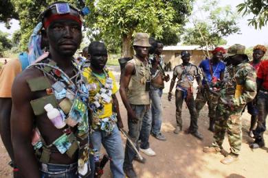Fighters from the Christian anti-balaka militia stand at their headquarters in the northern Bangui suburb of Boeing, an area near the Mpoko International Airport of Bangui, on 22 February 2014 (Photo: Reuters/Luc Gnago)
