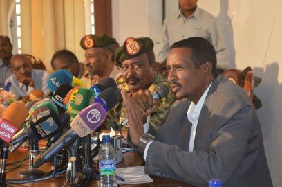 Sudan’s Rapid Support Forces (RSF) commander Abbas Abdel-Aziz (L) listens to RSF field commander Ahmed Hamdan (R) speaking in a press conference in Khartoum on Wednesday May 14, 2014 (ST)