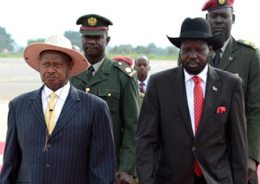 The presidents of Uganda and South Sudan Yoweri Museveni (L) and Salva Kiir walk side by side (Photo: Getty Images)
