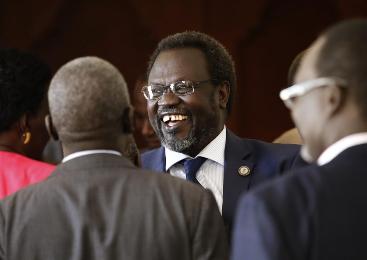 South Sudan's rebel leader, Riek Machar, smiles as he meets his friends at the Sheraton Hotel in Addis Ababa on 9 May 2014 (Photo: Reuters/Goran Tomasevic)