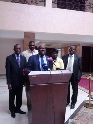 Clement Jada, the government's chief negotiator during peace talks with the David Yau Yau-led rebel group, speaks to reporters at the presidential office on 13 May 2014 flanked by other government delegates (ST)