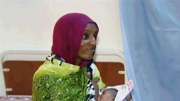 An image taken from an undated video provided on 5 June 2014 by Al Fajer, a Sudanese NGO, shows Meriam Ibrahim breastfeeding her newborn baby girl that she gave birth to in jail in May (Photo: AP/Al Fajer)