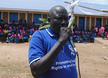 Plan International’s state coordinator, Graham Juma, speaks at the launch of an advocacy campaign targeting girls’ education in Eastern Equatoria’s Magwi county (ST)