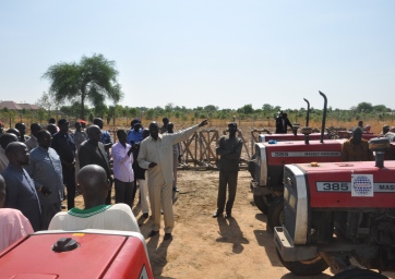 Jonglei's minister of agriculture and forestry, Mayen Ngor, pictured with a number of tractors which have been supplied as part of a youth farming initiative (ST)