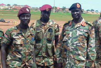Lakes state governor Maj-Gen Matur Chut Dhuol (far right) pictured with two soldiers from the South Sudan army's sixth division (ST)