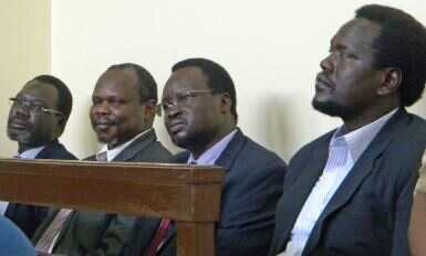 Ezekial Lol Gatkuoth (right) sits with his co-accused (from left) Oyay Deng Ajak, Pagan Amum Okiech, Majok D’Agot Atem at their trial for treason in Juba (Photo: Charlton Doki/VOA)