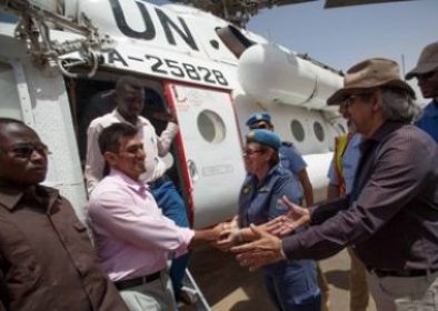 (From the left) UNAMID international contractor working at UNAMID, Irfan Jaffery, flanked by Sudanese security officers is welcomed by the UNAMID police commissioner, Ms. Hester Paneras, and some other Mission's senior staff members at El Fasher airport, on 12 June 2014 (Photo Albert Gonzalez Farran/UNAMID)