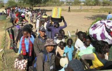 Civilians fleeing violence seek refuge at the UNMISS compound in the capital of South Sudan's Jonglei state, Bor, following the eruption of violence on 15 December 2013 (AP)