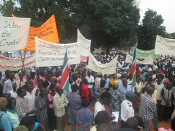 Wau residents gather outside the council of ministries after marching through the streets on 23 July 2014 in support of a proposal to transfer the national capital from Juba to Wau (ST)