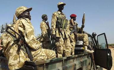 Soldiers from the South Sudanese army (SPLA) at Jonglei state's Bor airport after they recaptured the town from rebels (AFP)