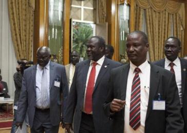 Rebel leader Riek Machar (C) flanked by Gabriel Changson Chang, his aide for finance and resource mobilisation (L), and chief negotiator General Taban Deng Gai (front) at 27th extraordinary summit of IGAD heads of state and government in Addis Ababa on 24 August 2014 (Photo: AFP/Zacharias Abubeker)