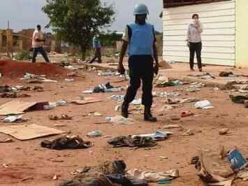 UN peacekeepers and NGO staff survey the debris outside a mosque in Unity state capital Bentiu, the scene of an alleged massacre after rebel troops regained control of the strategic town on 15 April 2014 (Photo: UNMISS/Tina Turyagyenda)