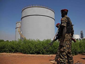 Soldiers from the South Sudanese army (SPLA) guard an oil facility (AFP)