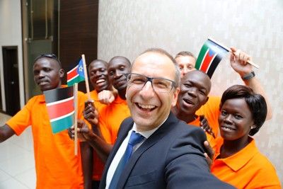 Cornel Krummenacher, CEO of Nestle Equatorial Africa (front) poses for a group photo with the winning team from Honey Care South Sudan on 8 October 2014 (Photo courtesy of Nestle)