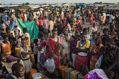 People wait to fill up their water containers at a camp for internally displaced people in Unity state capital Bentiu (Photo: Matthew Abbott/AP)