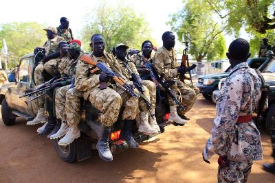 Soldiers from the South Sudanese army on the back of a truck (Photo: James Akena/Reuters)