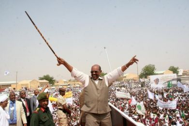 Omer Hassan al-Bashir gestures to supporters during his visit to Diwayaem town in White Nile State on July 7, 2011. (Reuters)