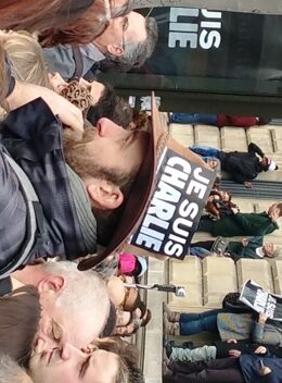 A man displays a sticker reading: 'Je suis Charlie' (I am Charlie) on his hat during a mass demonstration in solidarity with the victims of the terrorist attacks and to show unity, in Paris, on 11 January 2015. (ST)