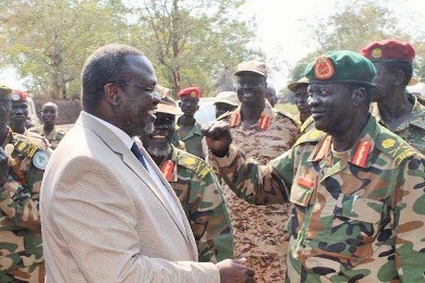 South Sudanese rebel leader Riek Machar with the commander of special division I, Gen James Koang Chol Ranley, in Pagak, on 8 December 2014 (ST)