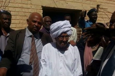 In this handout picture released by his defence team, a frail Farouk Abu Issa heads to the court in Khartoum on 3 February 2015 (ST)