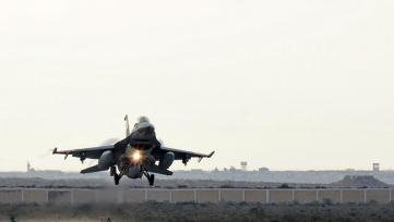 An Egyptian air force fighter jet lands at an undisclosed location in Egypt after air strikes against jihadist targets in Libya in this photo from Cairo's ministry of defence on 16 February 2015 (AFP)
