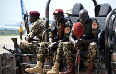 South Sudanese soldiers sit on a truck at the airport in Juba on 12 June 2014 (Photo: AFP/Samir Bol)