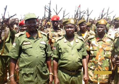 Rebel commander Brig General Joseph Gai Gatluak (left) pictured in front of his troops in Upper Nile state's Manyo county in March 2015 (ST)