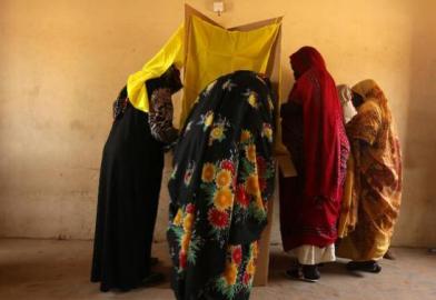 Sudanese women prepare to cast their votes at a polling station in a classroom in Khartoum's southern suburb of Mayo (Photo: AFP/Patrick Baz)