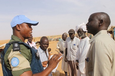 A UNAMID police adviser interacts with community leaders during a routine patrol in the ZamZam camp for the internally displaced near El Fasher, North Darfur. (Photo UNAMID/Ali Aloita).