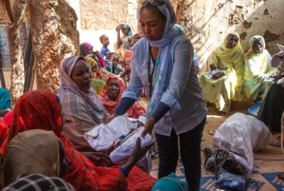 On 4 May 2015 UNAMID's Community Outreach Unit hands over promotional items such as T-shirts, caps, to a women’s group at the Abu Shouk camp for IDPs, North Darfur. (Photo UNAMID/Hamid Abdulsalam)