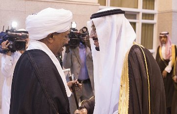 FILE - Sudanese president Omer Hassan al-Bashir shaking hands with Saudi King Salman bin Abdulaziz (Riyadh newspaper)