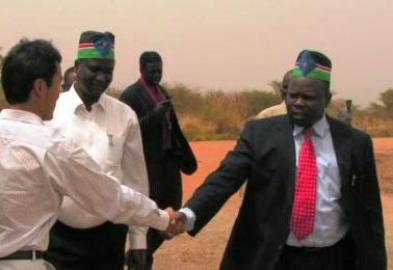 SPLM SG Pagan Amum shakes hands with a Chinese oil worker in Bentinu during a visit to the oil fileds in Unity state in 2008. The then governor of Unity state Taban Deng Gai accompanied him in his tour. (SPLM Photo)