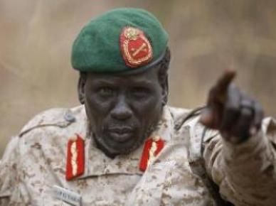 Rebel General Peter Gatdet Yaka gestures as he speaks to South Sudan's rebel leader Riek Machar (not seen) in a rebel controlled territory in Jonglei  February 1, 2014. (Photo Reuters/Goran Tomasevic)