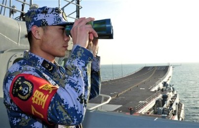 A naval soldier of the Chinese People's Liberation Army onboard China's first aircraft carrier 'Liaoning' (Photo Reuters)