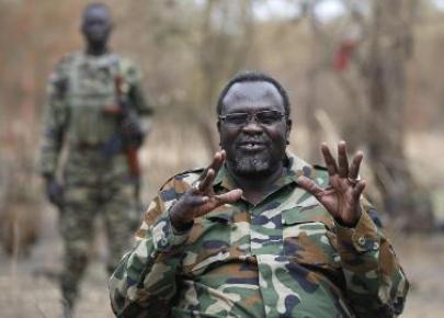 Riek Machar gestures as he speaks to rebel General Peter Gatdet Yaka (not seen) in a rebel controlled territory in Jonglei  on February 1, 2014. (Photo Reuters/Goran Tomasevic)