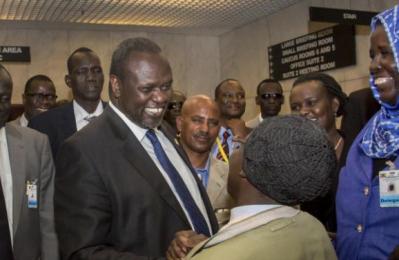 South Sudan's rebel leader Riek Machar, center, greets unidentified participants after lengthy peace negotiations in Addis Ababa, Aug. 17, 2015 (Photo AP/Mulugeta Ayene)
