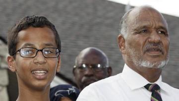 Ahmed Mohamed, 14, left, stands next to his father Mohamed al-hassan Mohamed as he thanks supporters during a news conference at his home, Wednesday, Sept. 16, 2015, in Irving, Texas (AP Photo/Brandon Wade)