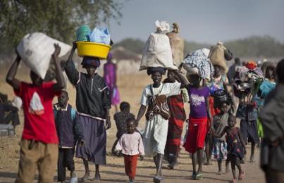 Displaced people walk after arriving by river barge from Bor to Awerial in South Sudan’s Lakes State on Jan. 2, 2014  (Photo AP/Ben Curtis)