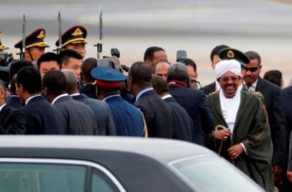 Sudanese President Omar al-Bashir, right, arrives at Beijing Capital International Airport in Beijing, China, Tuesday, Sept. 1, 2015. (Photo AP/Ng Han Guan)