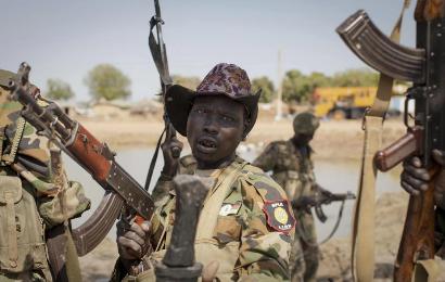 A South Sudanese government soldier chants in celebration after government forces on Friday retook Bentiu, in Unity State, South Sudan, Sunday, Jan 12, 2014. (Photo AP/Mackenzie Knowles-Coursin)