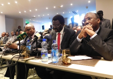Flanked by SPLM-N SG Yasir Arman and JEM chief negotiator Ahmed Tugud, SLM Minni Minnawi (C) speaks at the opening session of the AUHIP brokered session for comprehsnive cessation of hostilities in Sudan, in Addis Ababa on 19 November 2015 (ST Photo)