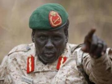 Rebel General Peter Gatdet Yaka gestures as he speaks to South Sudan's rebel leader Riek Machar (not seen) in a rebel controlled territory in Jonglei  February 1, 2014. (Reuters/Goran Tomasevic)