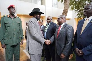 President Salva Kiir greeting South Sudanese officials in South Africa December 3, 2015 (Photo credit: Larco Lomayat)