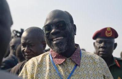 Ramadan Hassan Lako, a member of SPLM-IO advance team, greets government officials upon arrival to Juba after two year's in exile on Monday, Dec. 21, 2015 (AP Photo/Jason Patinkin)