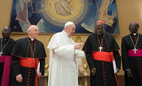 Pope Francis speaks with the Sudanese Cardinal Gabriel Zubeir as they pose for a collective picture with the members of the joint Sudanese South Sudanese delegation on January 20, 2016 (Photo Obsservatore Romano)